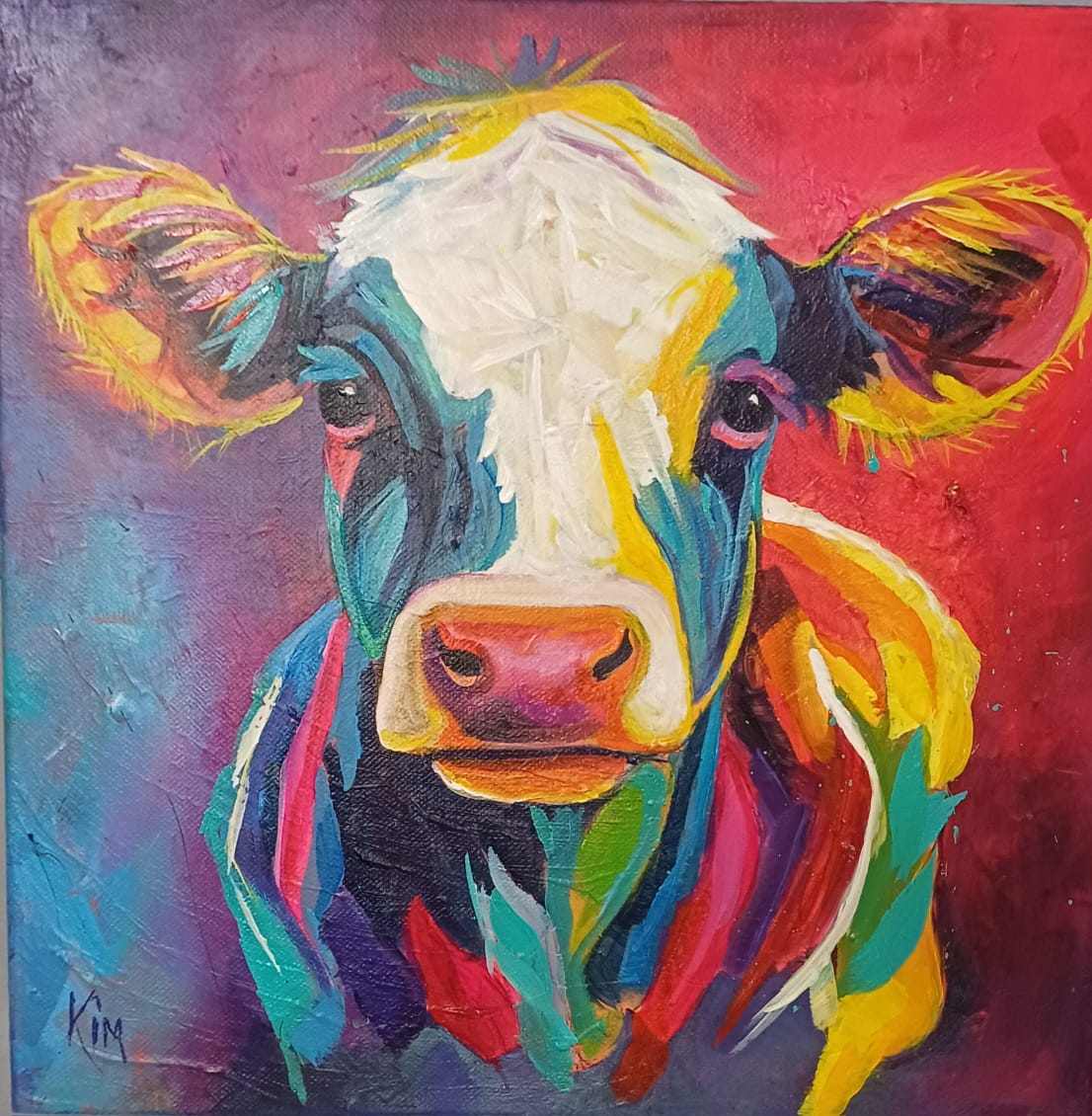 Original painting of a cow in white, blue and yellow patches by Kim Bezuidenhout